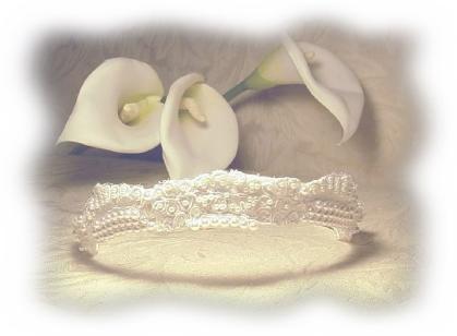 Elegant couture Alen�on lace tiara with hand sewn pearls and sequins.